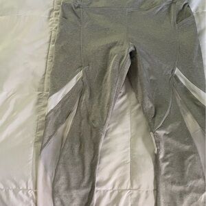 Avia heathered grey Capri leggings with sheer white cutouts. Size M (8 -10)